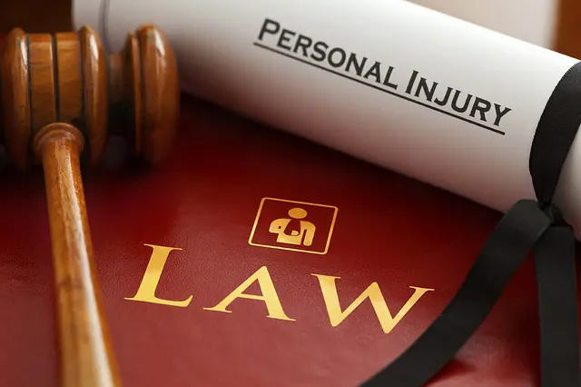a wooden gavel sits on top of a law book