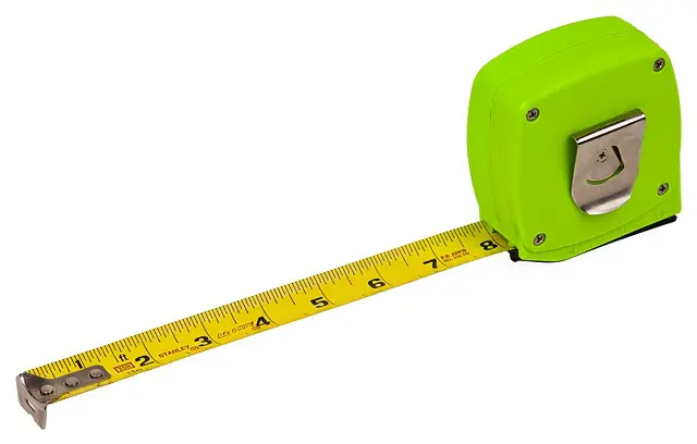 a green tape measure displaying 8 inches