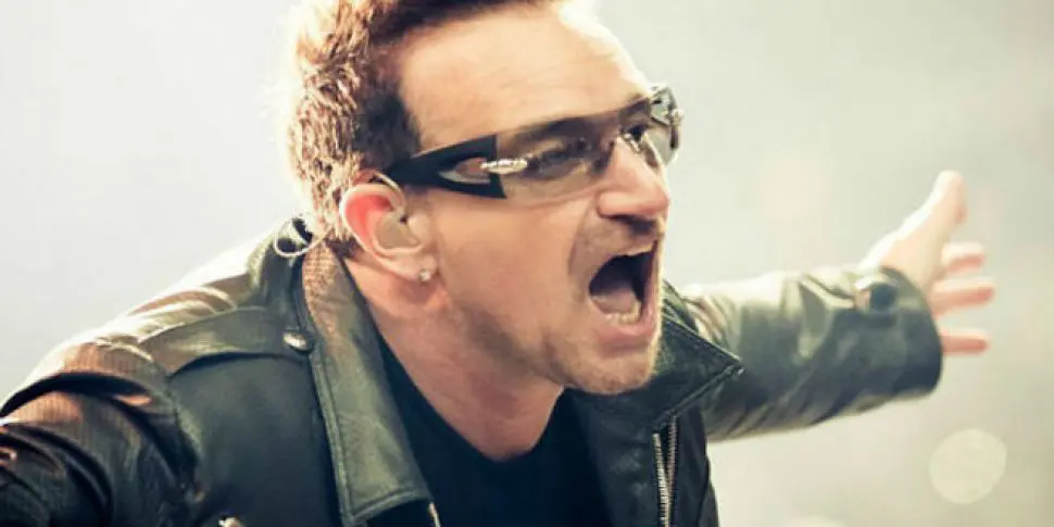 a man wearing sunglasses and a leather jacket is screaming