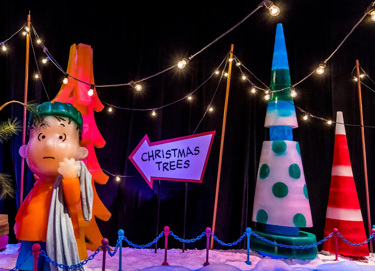 Charlie Brown christmas decorations with sign pointing to christmas trees