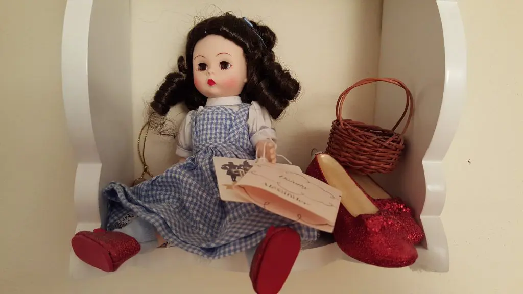 Wizard of oz doll sitting on shelf