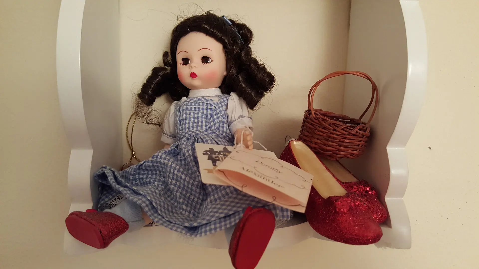 Wizard of oz doll sitting on shelf