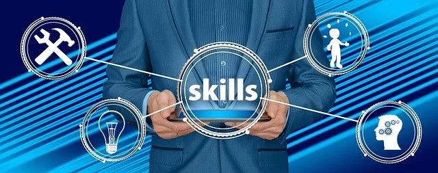a man in a suit is holding a tablet with the word skills on it