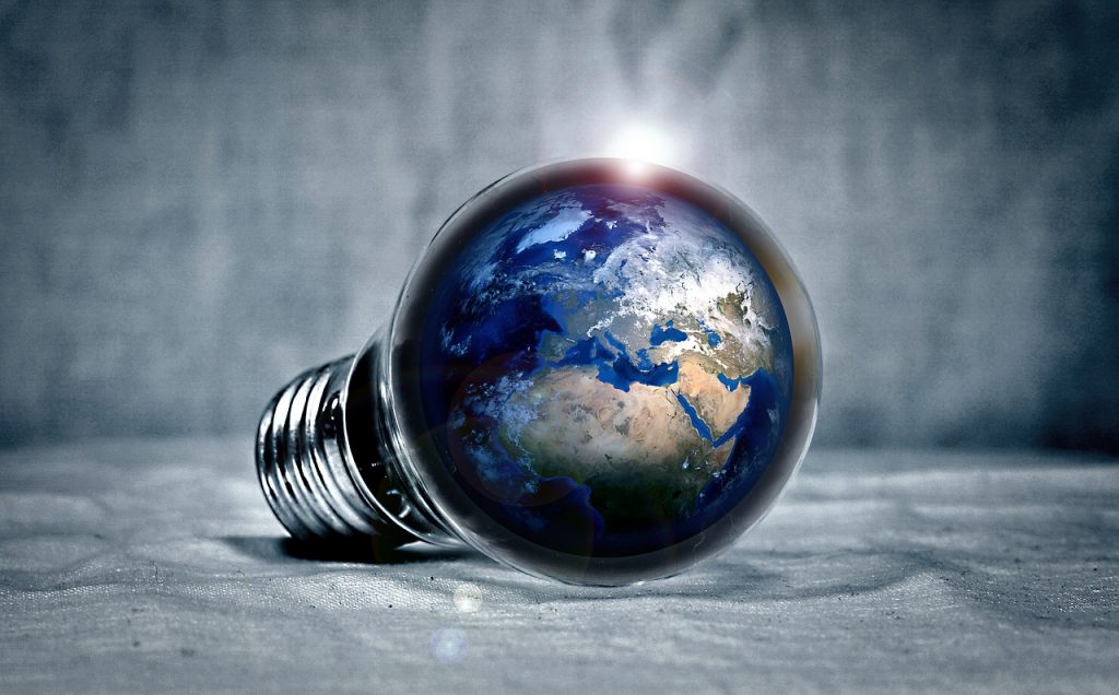 a light bulb with the earth inside of it