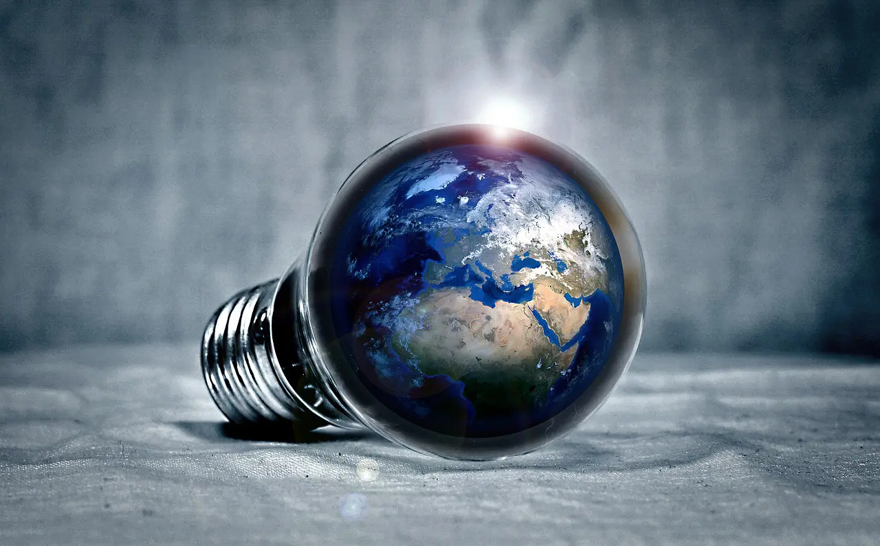 a light bulb with the earth inside of it
