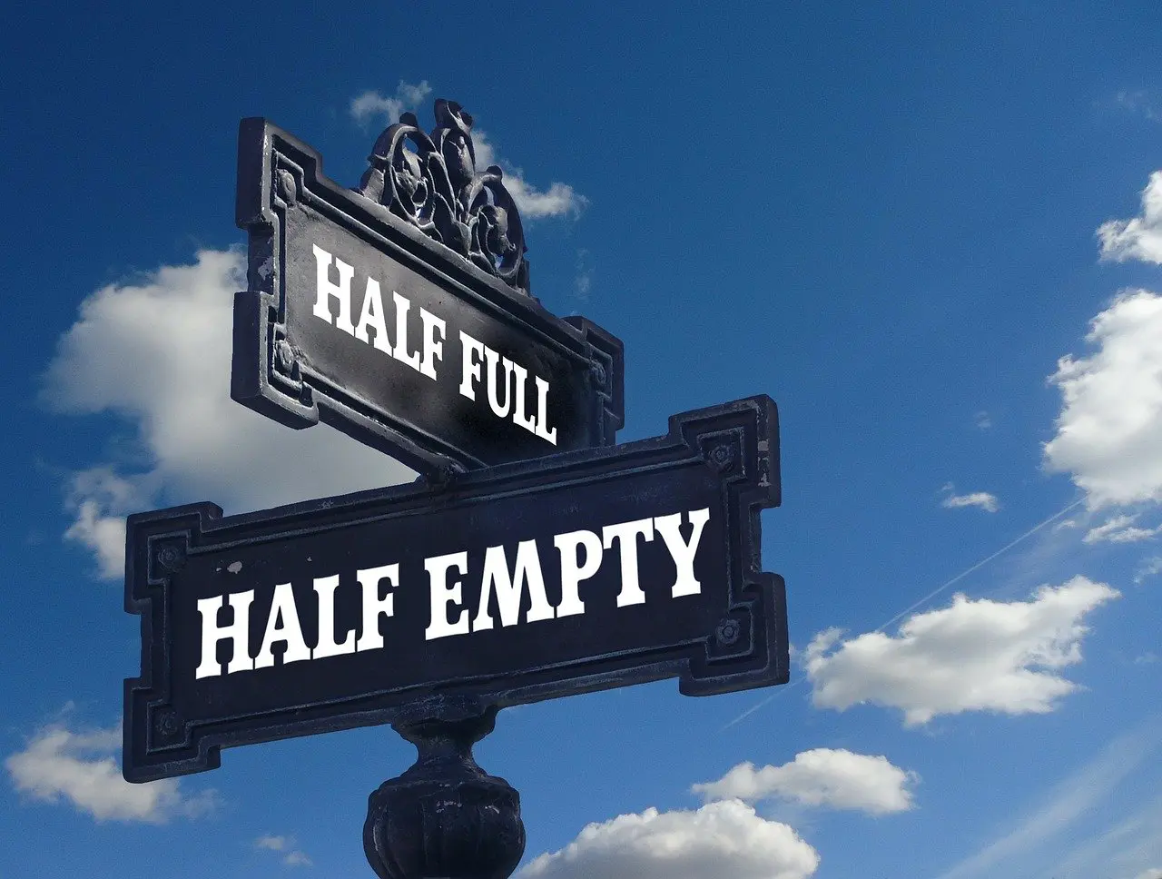 a street sign that says half full and half empty