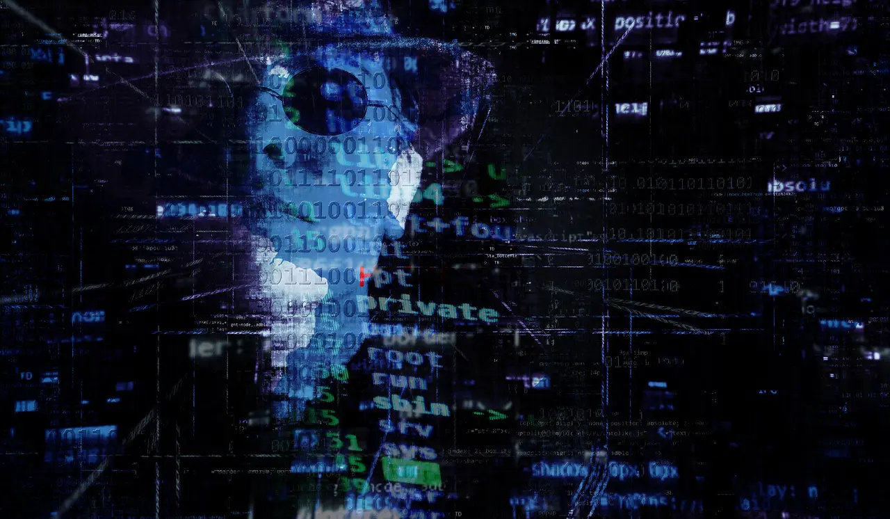 man with a hat behind a coding screen
