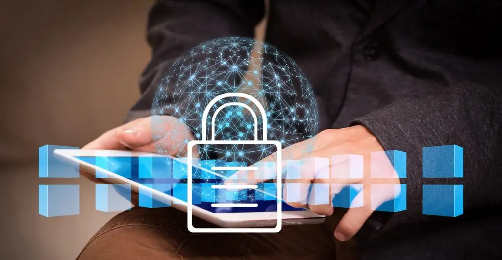a person holding a tablet with a padlock on it