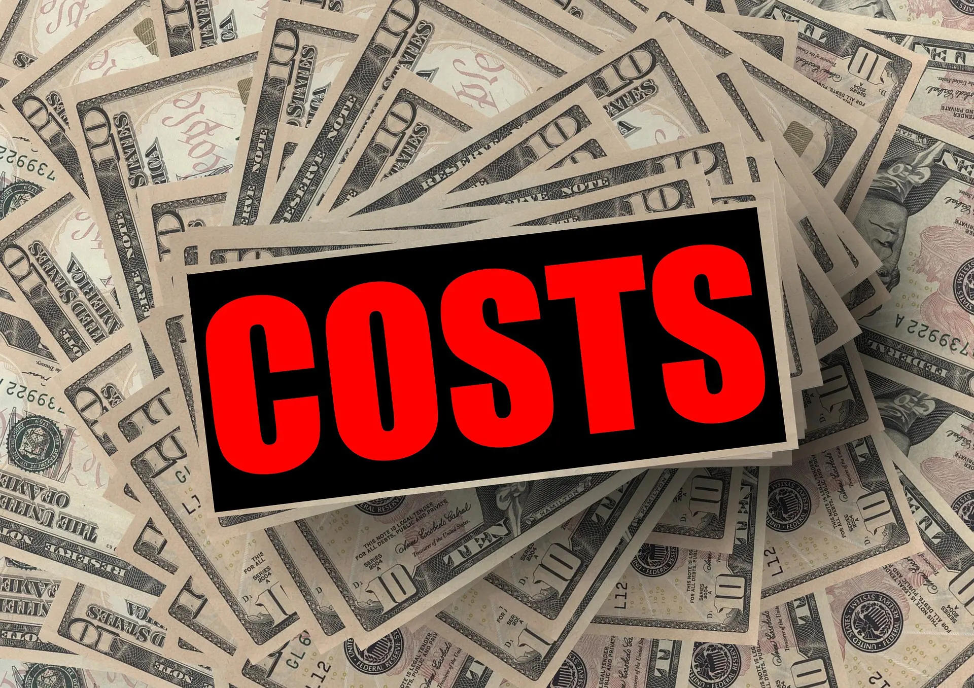 a pile of money with the word costs written on it