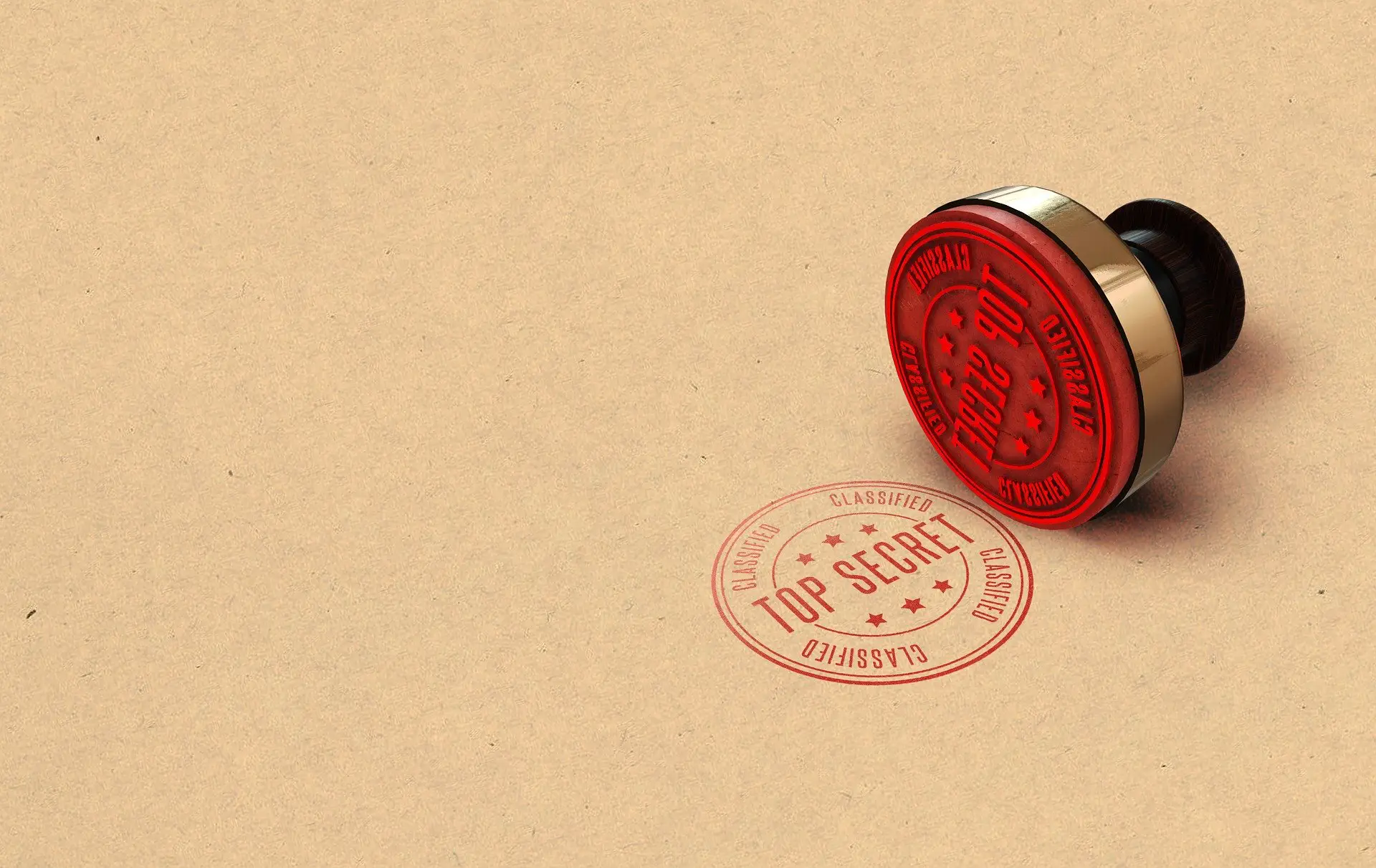 a stamp lying on its side with its design featured on the surfacing it is lying on