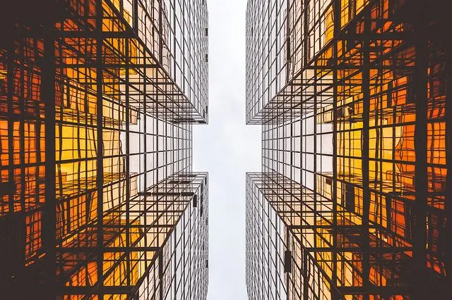 looking up at a tall building with a lot of windows