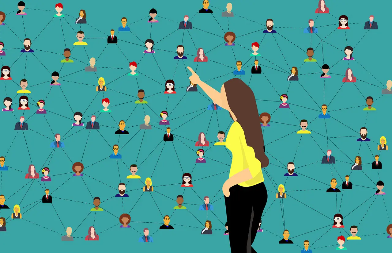 a woman in a yellow shirt points to a group of people