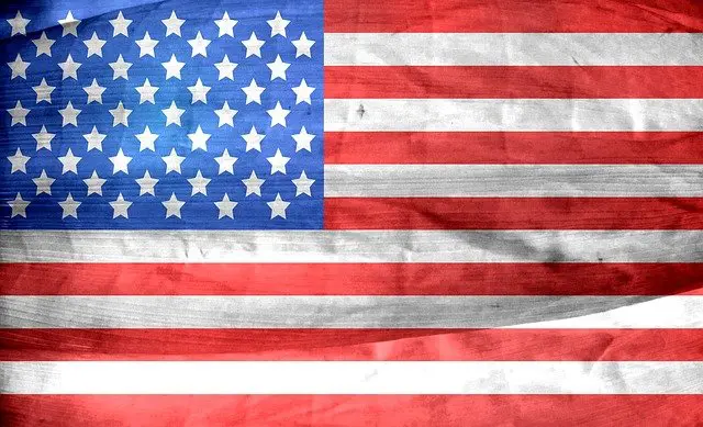 Close up of an American flag with stars and stripes on it