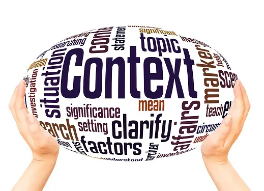 hands holding a sphere with the word context on it