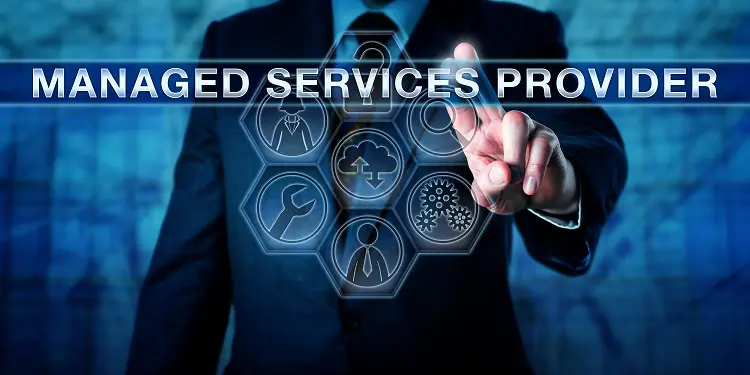 an individual in a suit standing in frame with two of their fingers pointed forwards towards a selection of icons and the text 'managed services provider'