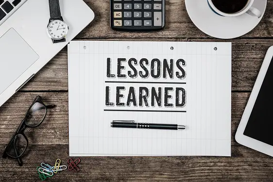 piece of paper with the words lessons learned written on it