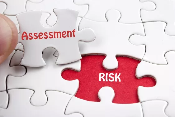 a puzzle featuring the words 'assessment' and 'risk' on a puzzle piece and in an empty spot that piece fits into
