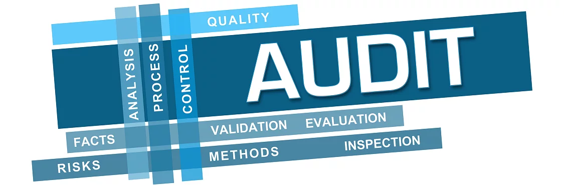 the word audit that is on a blue background