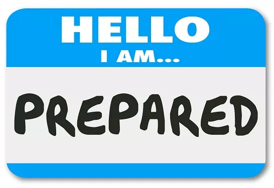a blue and white hello i am prepared name tag