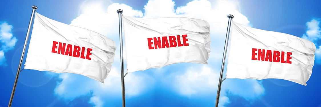 three white flags blowing in the wind with the word 'enable' on them