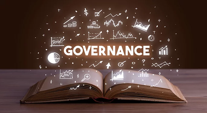 an open book with the word governance coming out of it