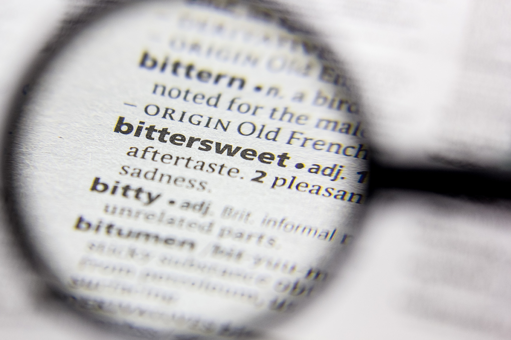 a magnifying glass shows the definition of bittersweet