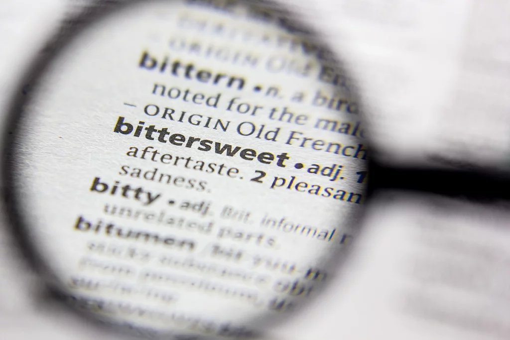 a magnifying glass shows the definition of bittersweet