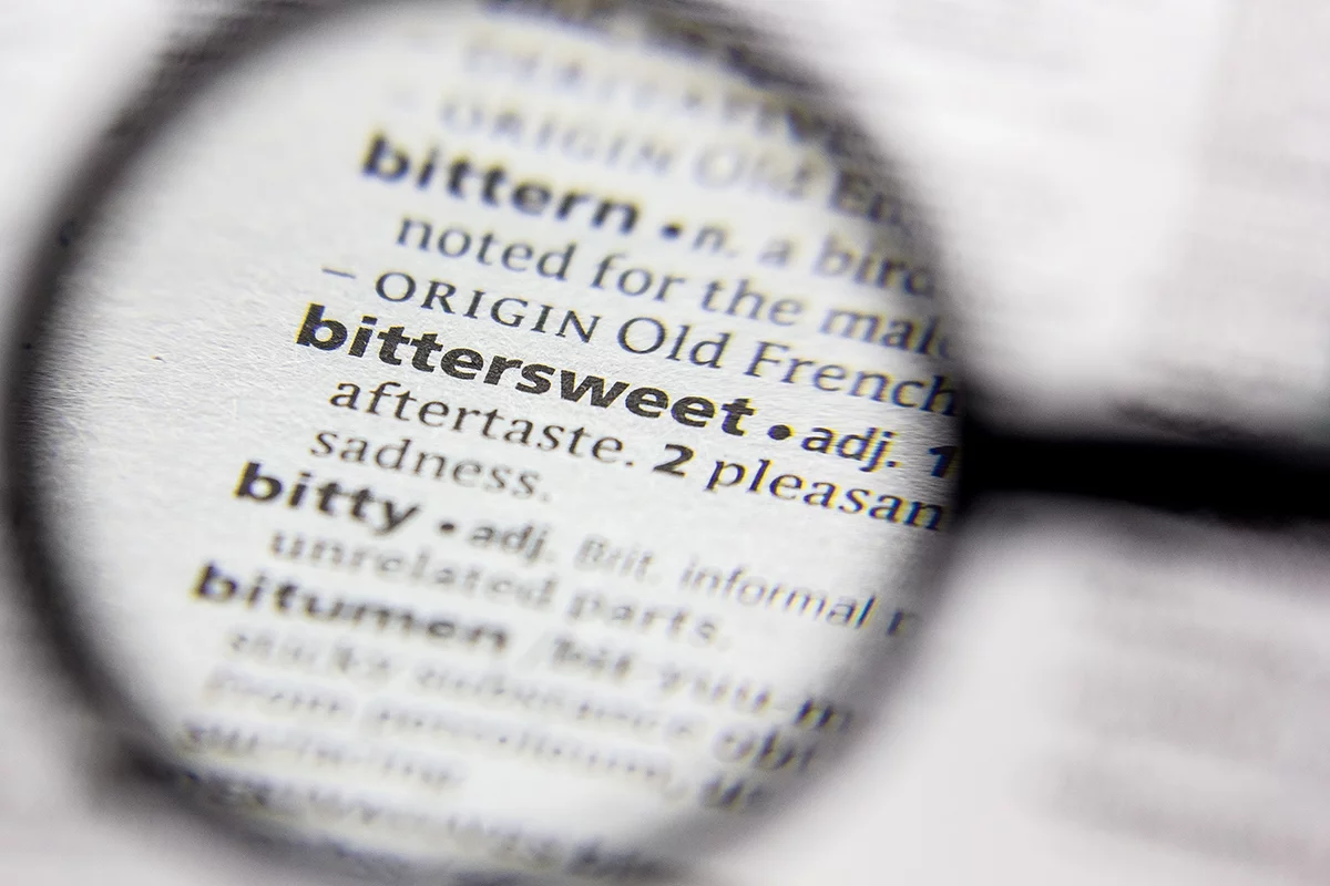 a magnifying glass shows the definition of bittersweet