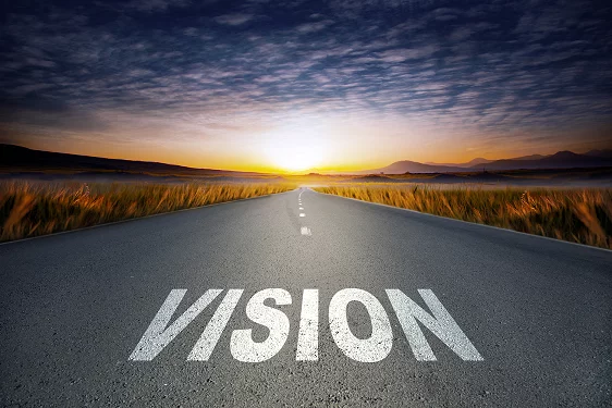 a road with the word vision painted on it