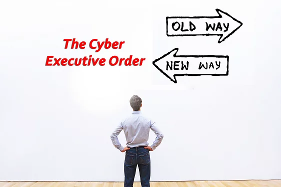 a man stands in front of a wall that says the cyber executive order with arrows for the old and new way