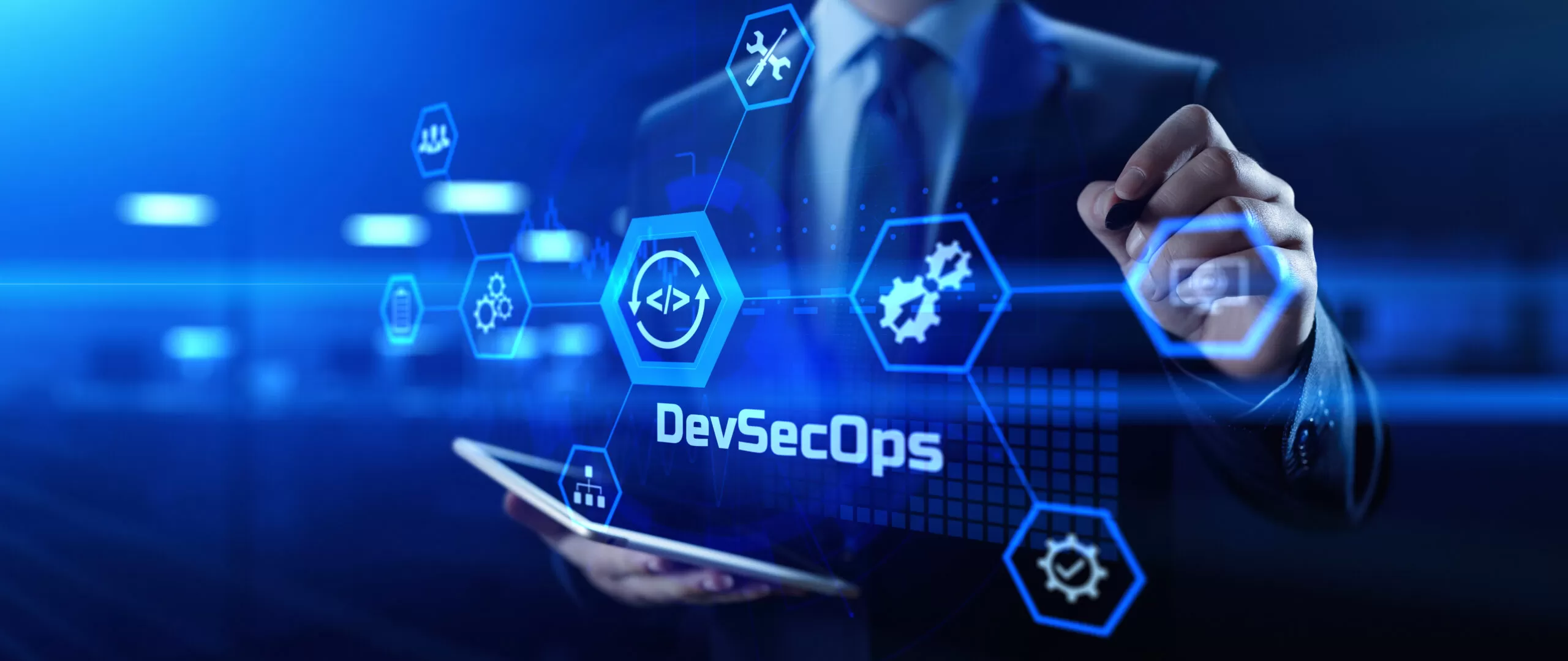 a man in a suit is holding a tablet and writing on a screen that says devsecops