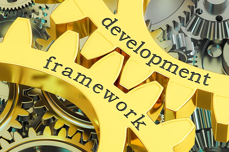 a gold gear with the words development framework on it