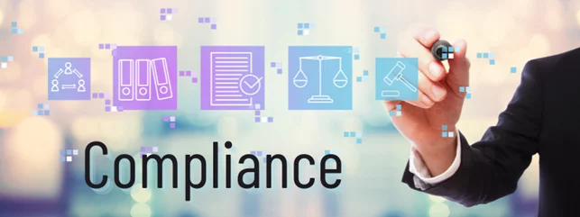 a person is writing the word compliance with a marker