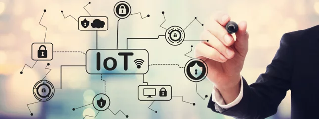 a person is writing on a screen with a marker that says iot