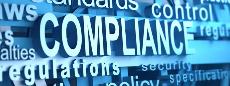 the word compliance is on a blue background